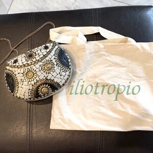 Tile and brass purse